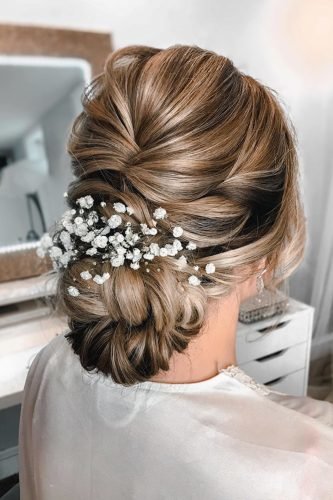 wedding updos textured low bun with baby breath bridalhairbykatelyn