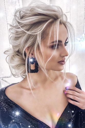 wedding updos textured low updo on blonde hair with curls juliykravchuk