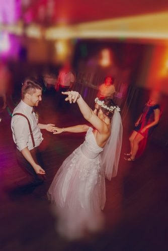average price of a wedding band bride and groom dancing with wedding guests