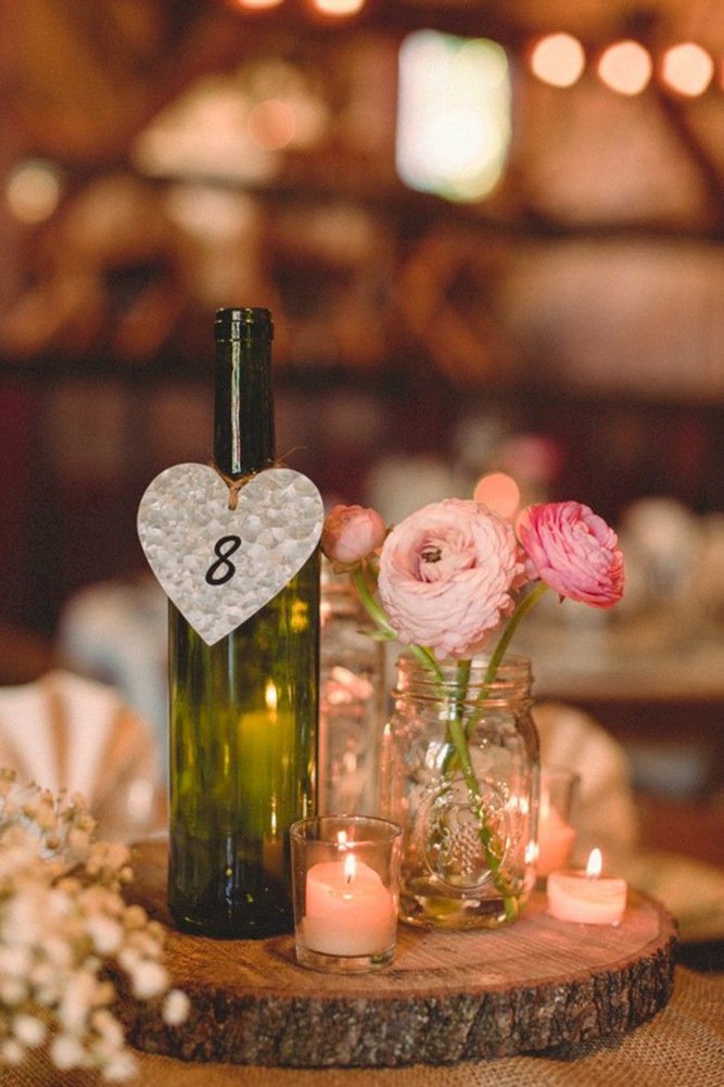 rustic wedding centerpieces bottle with number and flower mason jar jill tiongco photography