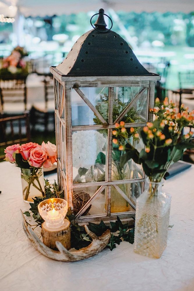 rustic wedding centerpieces lantern with candles flowers amandabasteen