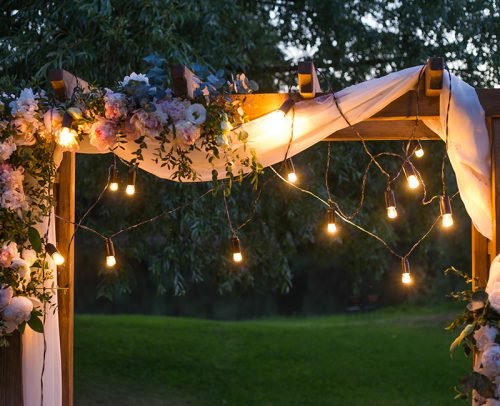 casual wedding planning wedding arch with lighting