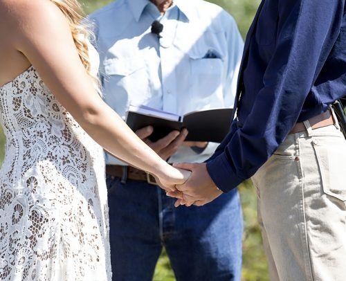 officiant prices for wedding ceremony couple holding hands