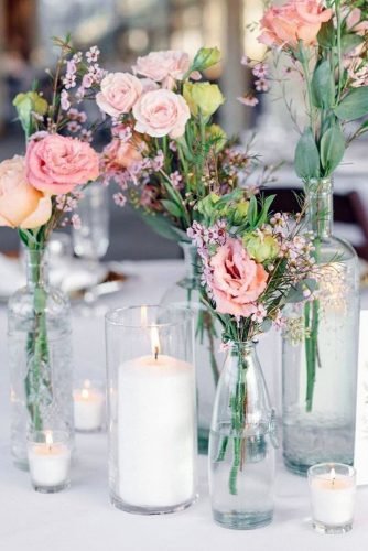 wedding centerpieces spring flowers in glass bottles savanphotography