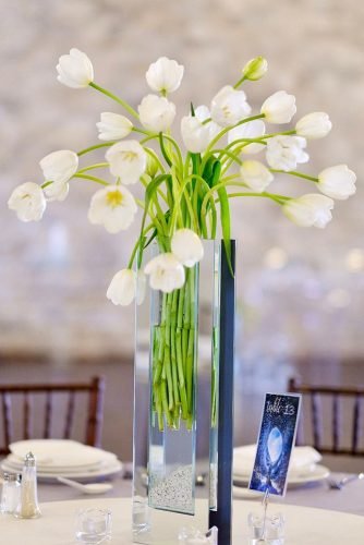 wedding centerpieces tall vase with tulips chezrosefloraldesigns