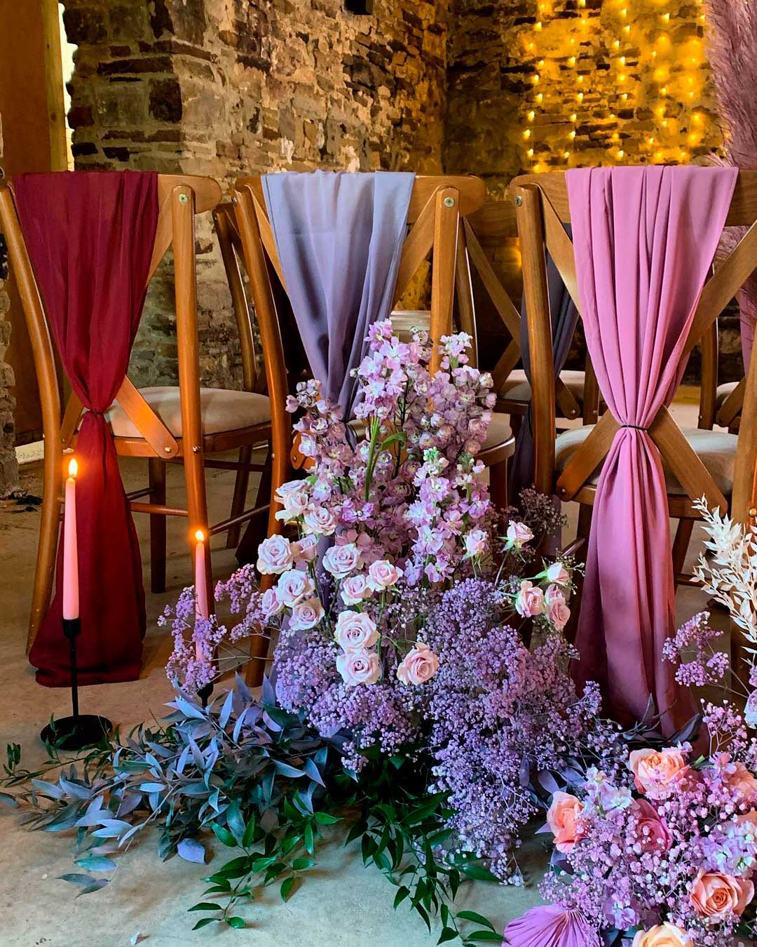 wedding reception decor purple flowers chairs