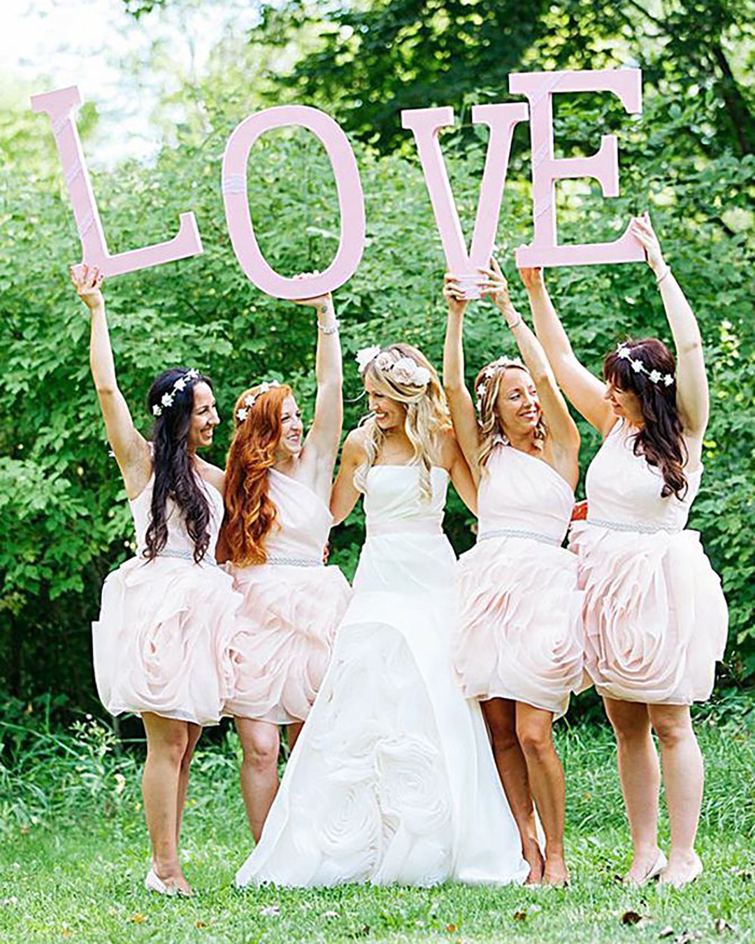 fun photos with bridesmaids holding love Rachwal Photographysign