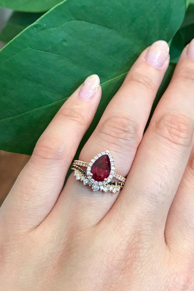 ruby engagement rings pear cut ruby halo rose gold pave band
