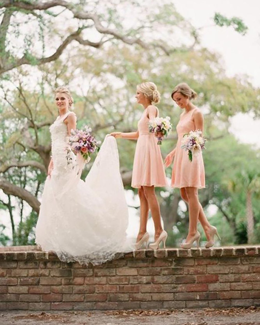 wedding photos with your bridesmaids girl near tree emily heizer photography