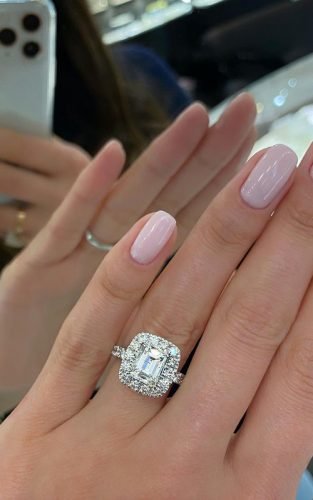 engagement ring emerald cut diamond halo pave band