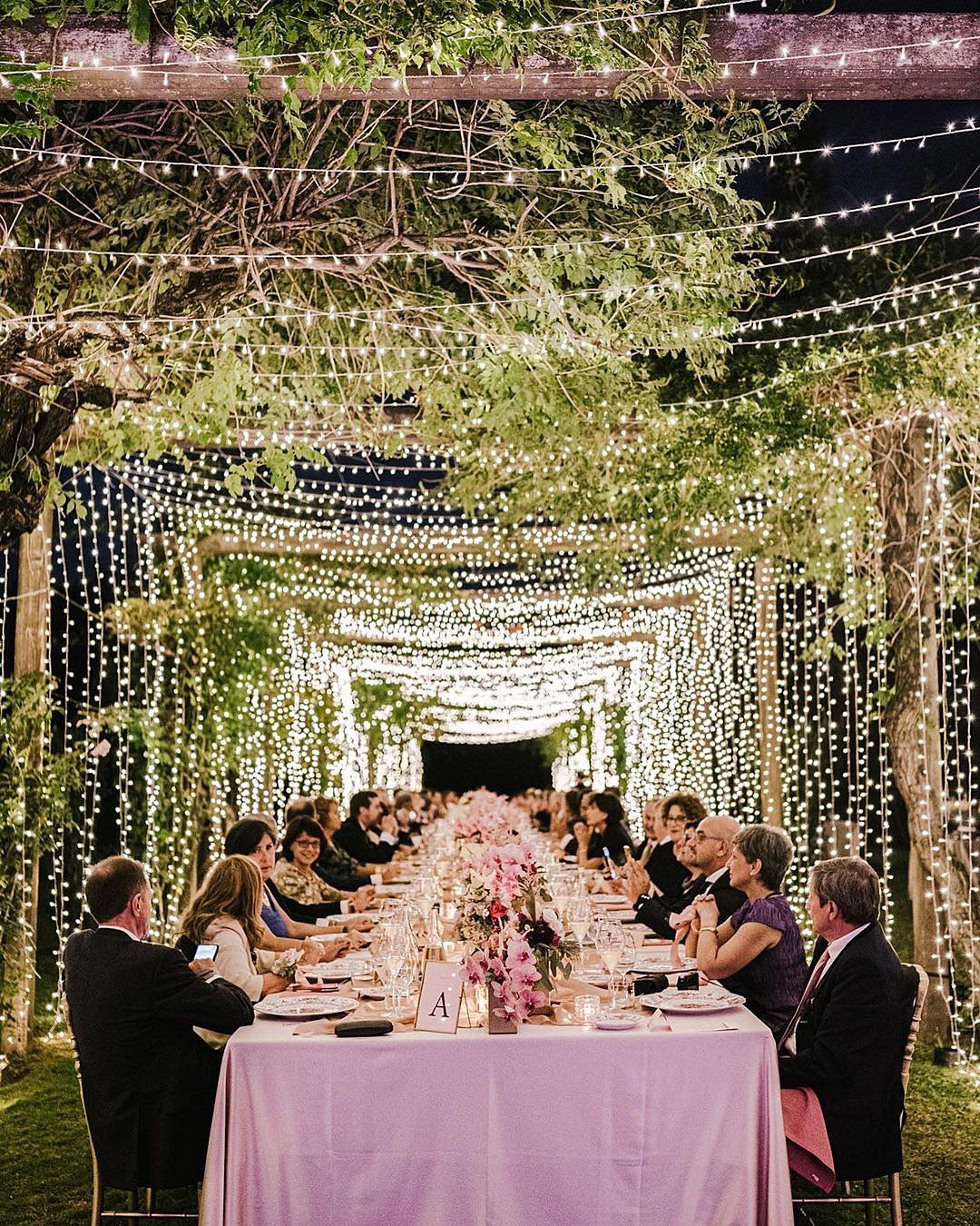 forest wedding theme outdoor reception lights