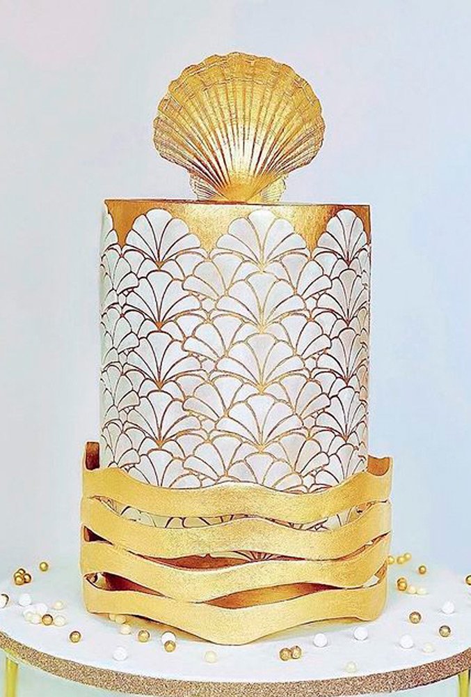 hand painted wedding cakes golden sea theme