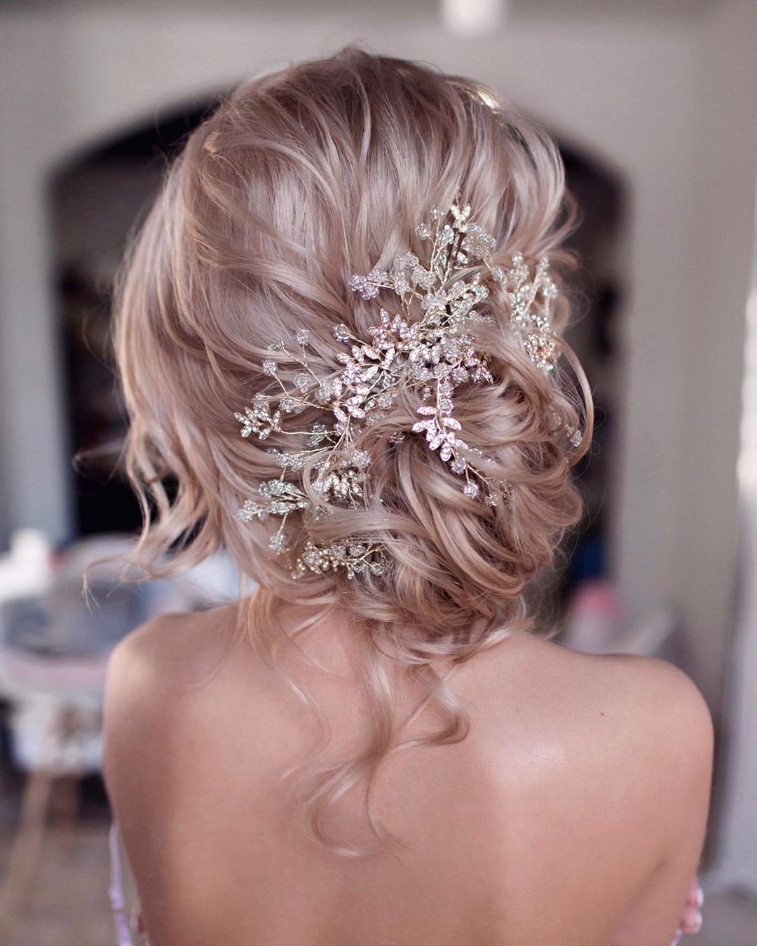 wedding hairstyles slightly messy curly updo with decor