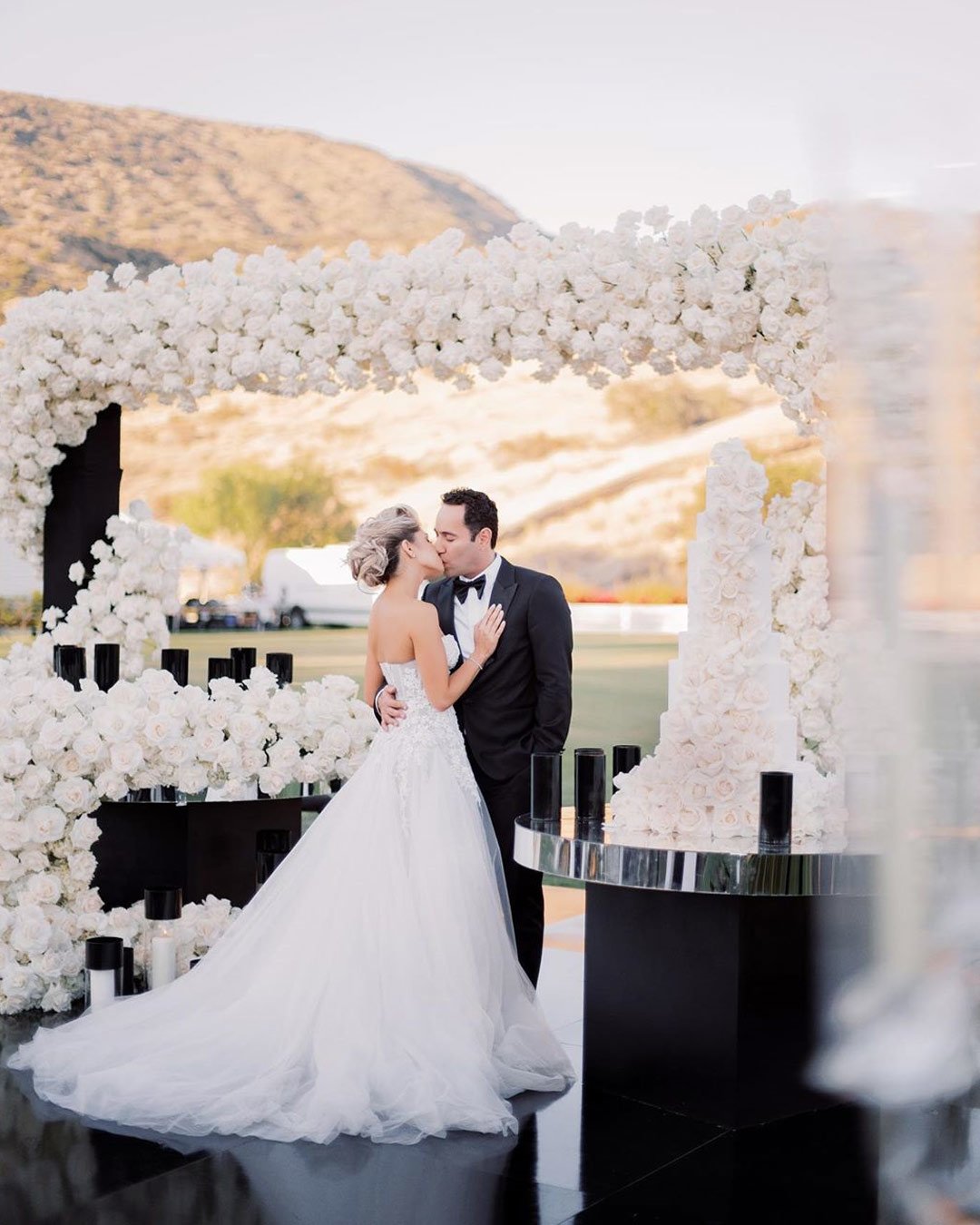 black white wedding colors bride groom flowers arch