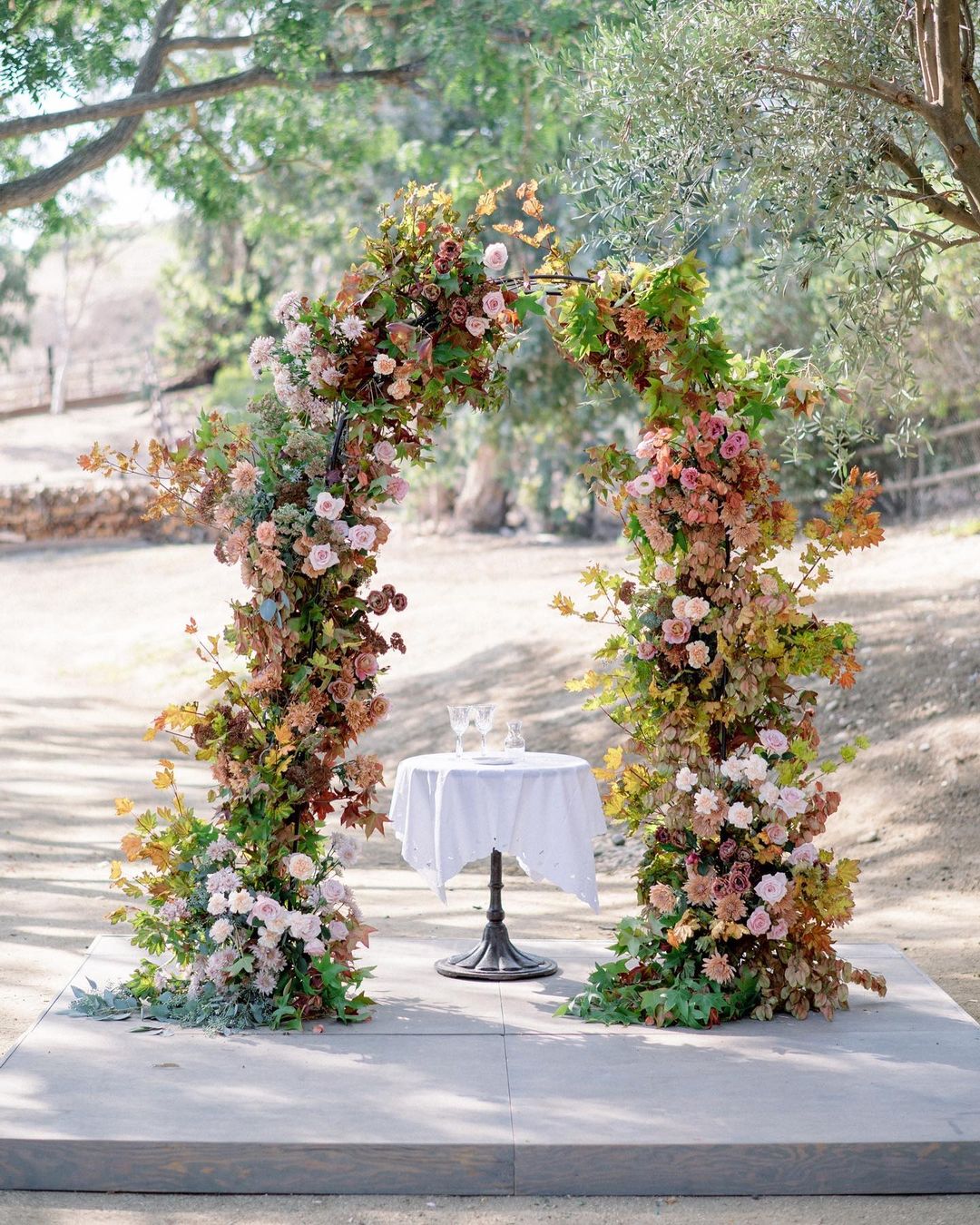 fall wedding colors arch with foliage