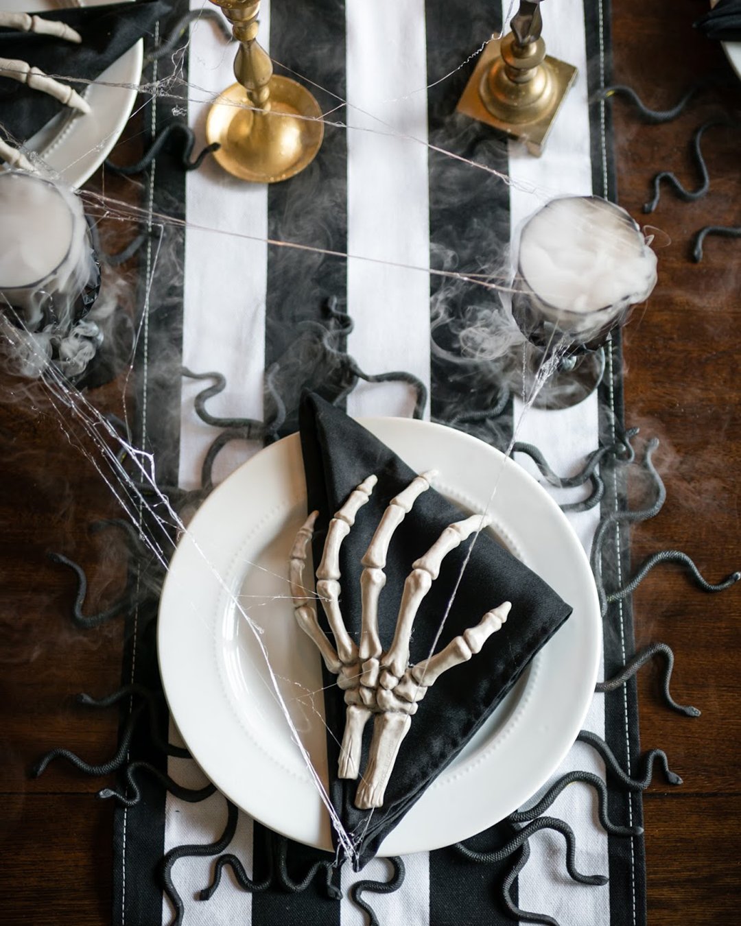 halloween bridal shower ideas black white tablecloth skeleton hand dinner