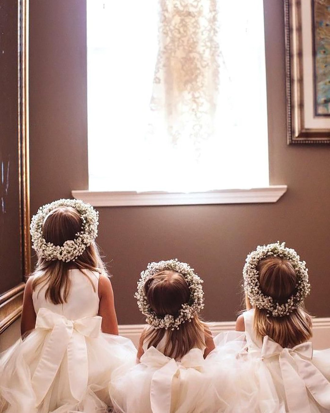 must have wedding photos cute flower girls looking on the hanging wedding dress little miss creative