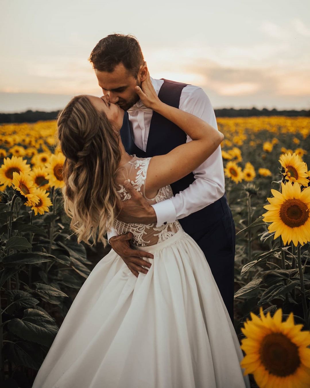micro wedding venues groom and bride on sunflower field janasnuderl