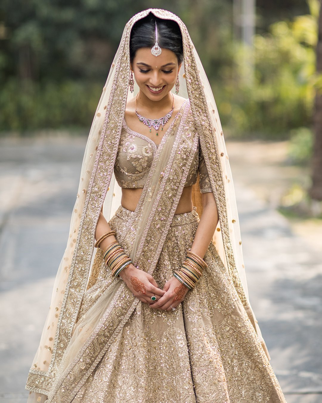 indian wedding dresses gold with detached skirt veil sequins embelishment malvika periwav