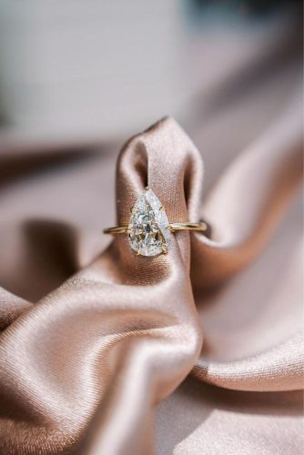 engagement ring with pear cut center stone rings