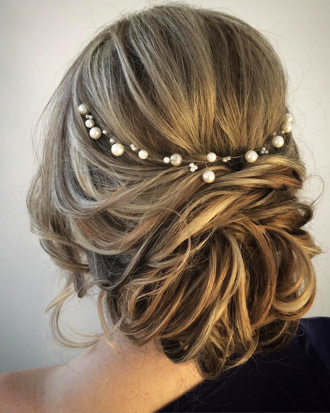 mother of the bride hairstyles messy low updo with pearls lenabogucharskaya