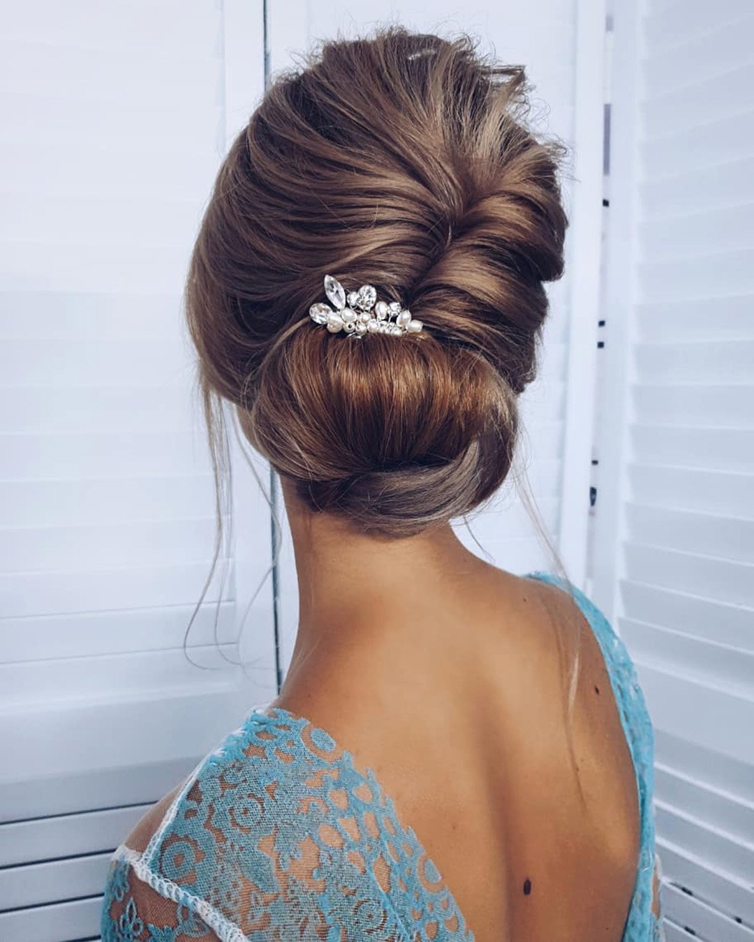 wedding updos elegant volume low bun with crystal pin ksenya_makeup
