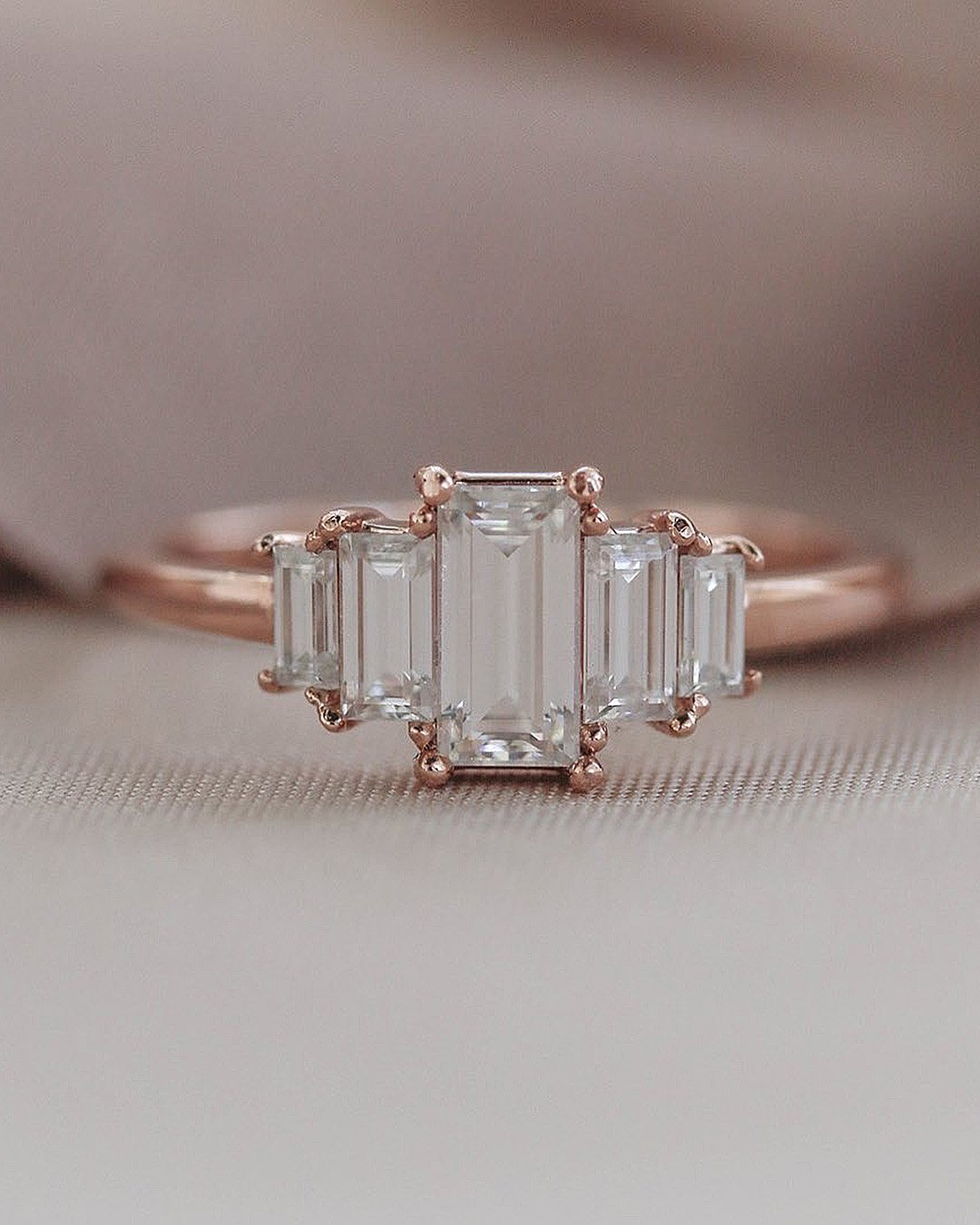 emerald cut engagement rings diamonds three stones rose gold
