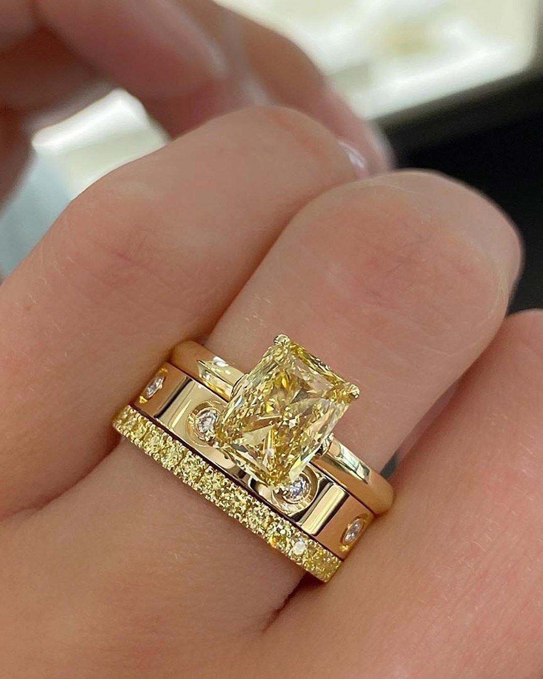 emerald cut engagement rings yellow diamond set