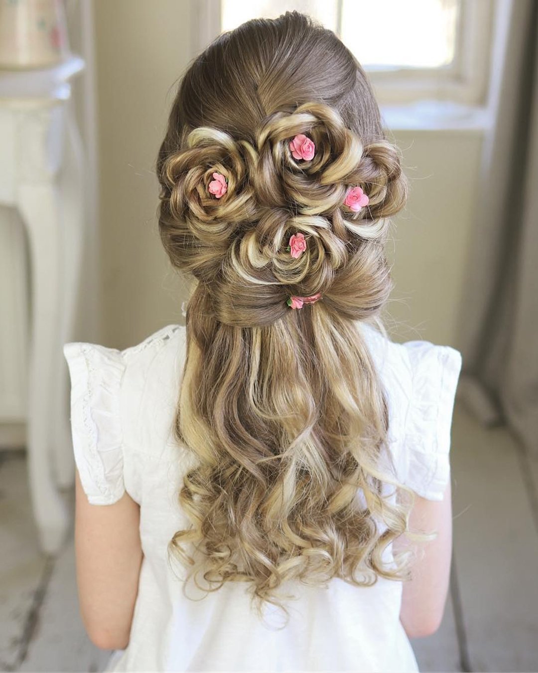 flower girl hairstyles half up half down with flowers and swept sweethearts_hair