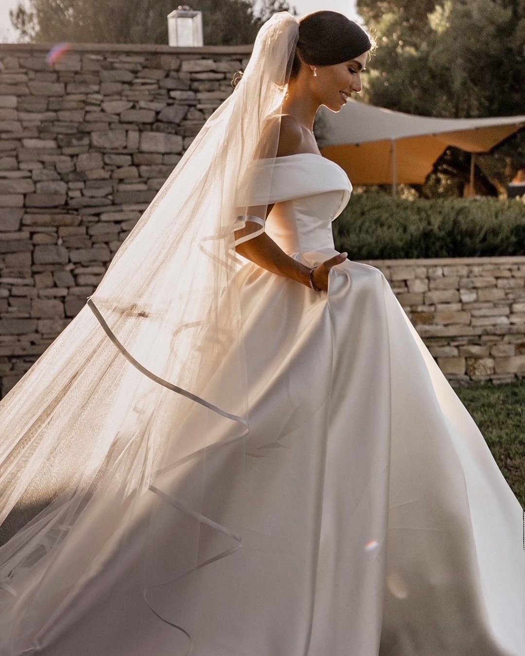 Simple off-the-shoulder wedding dress