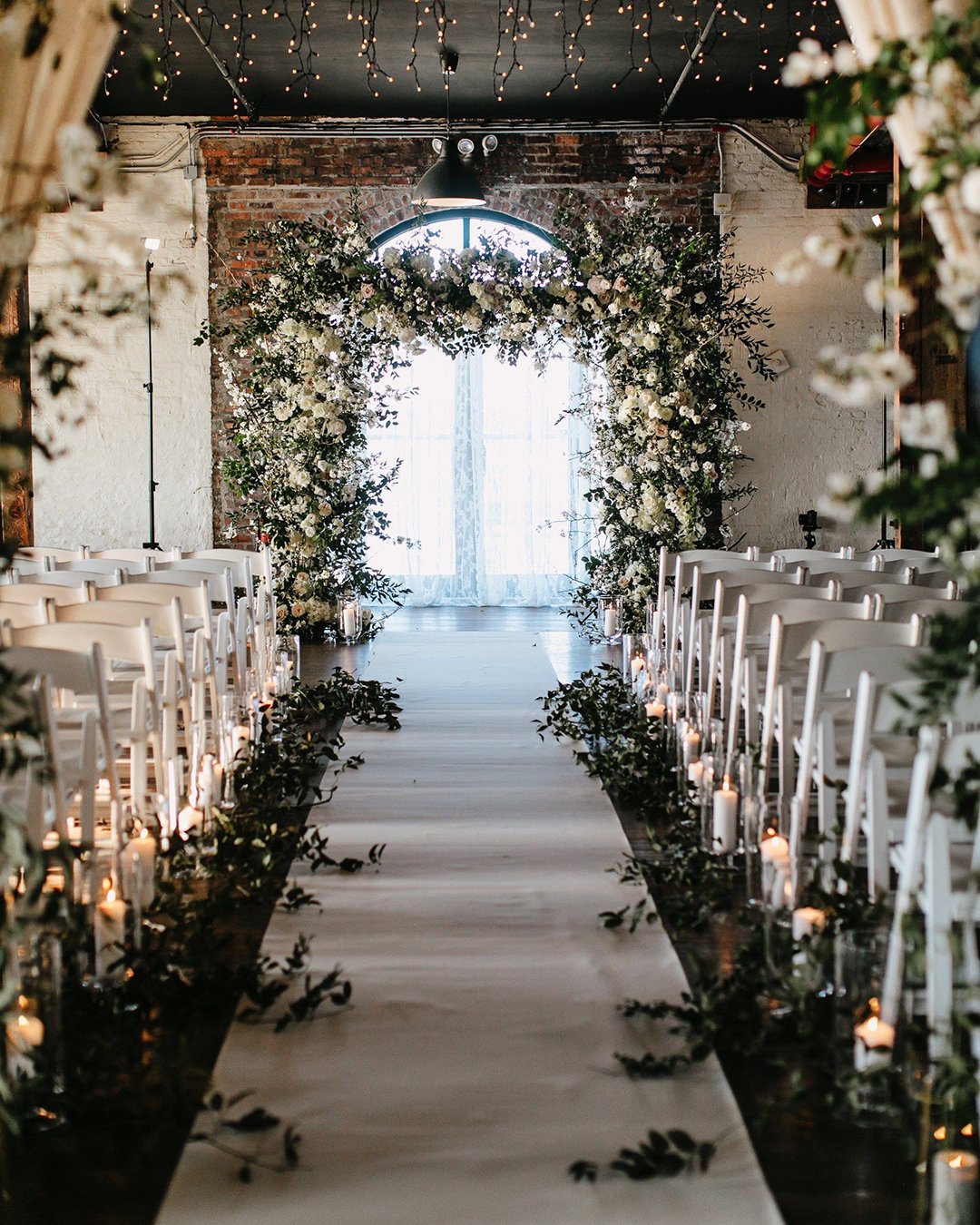 rustic wedding décor with greenery flower arch candle aisle pat furey photography