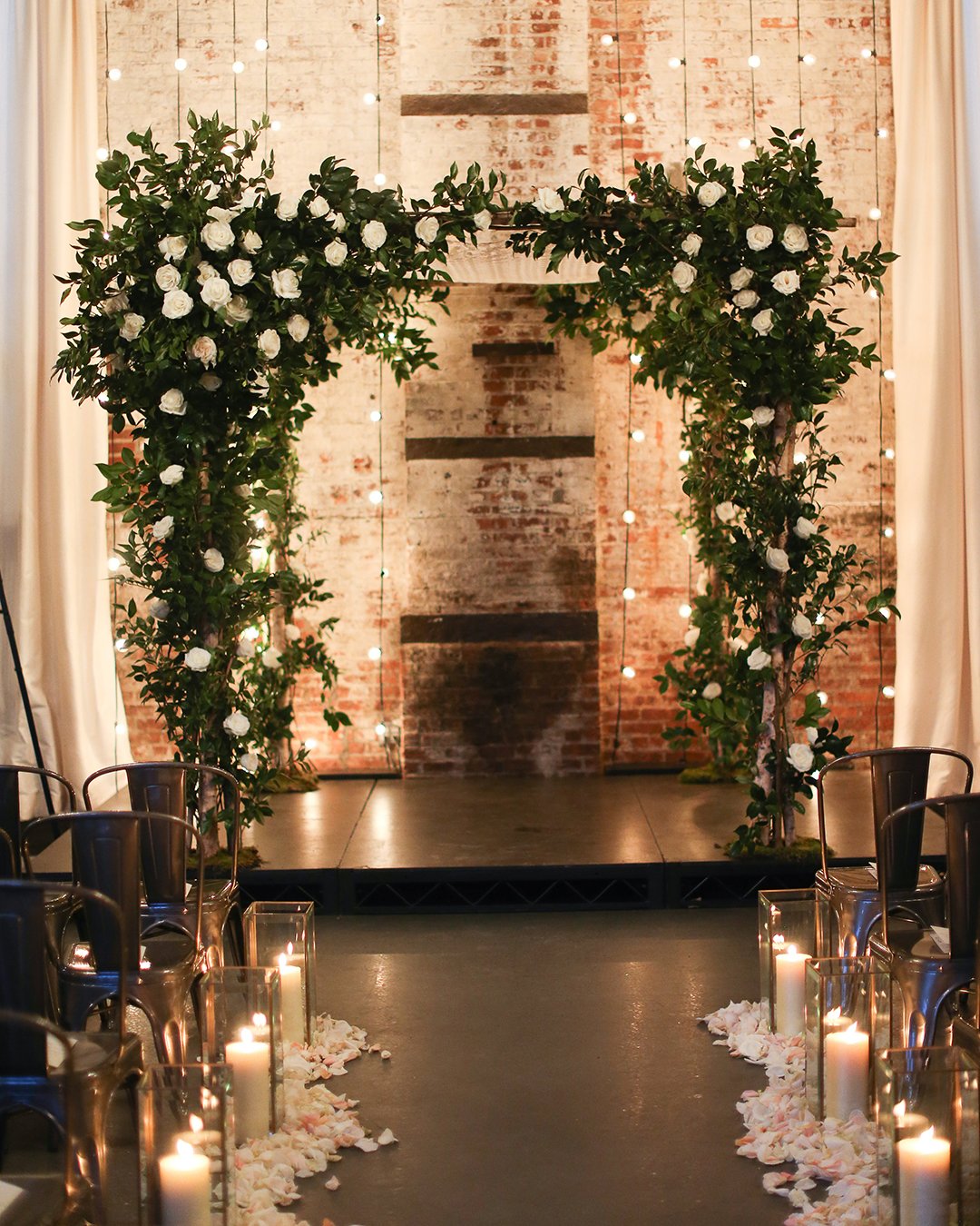 winter wedding decorations arch with white rose and lamps alisonconklin