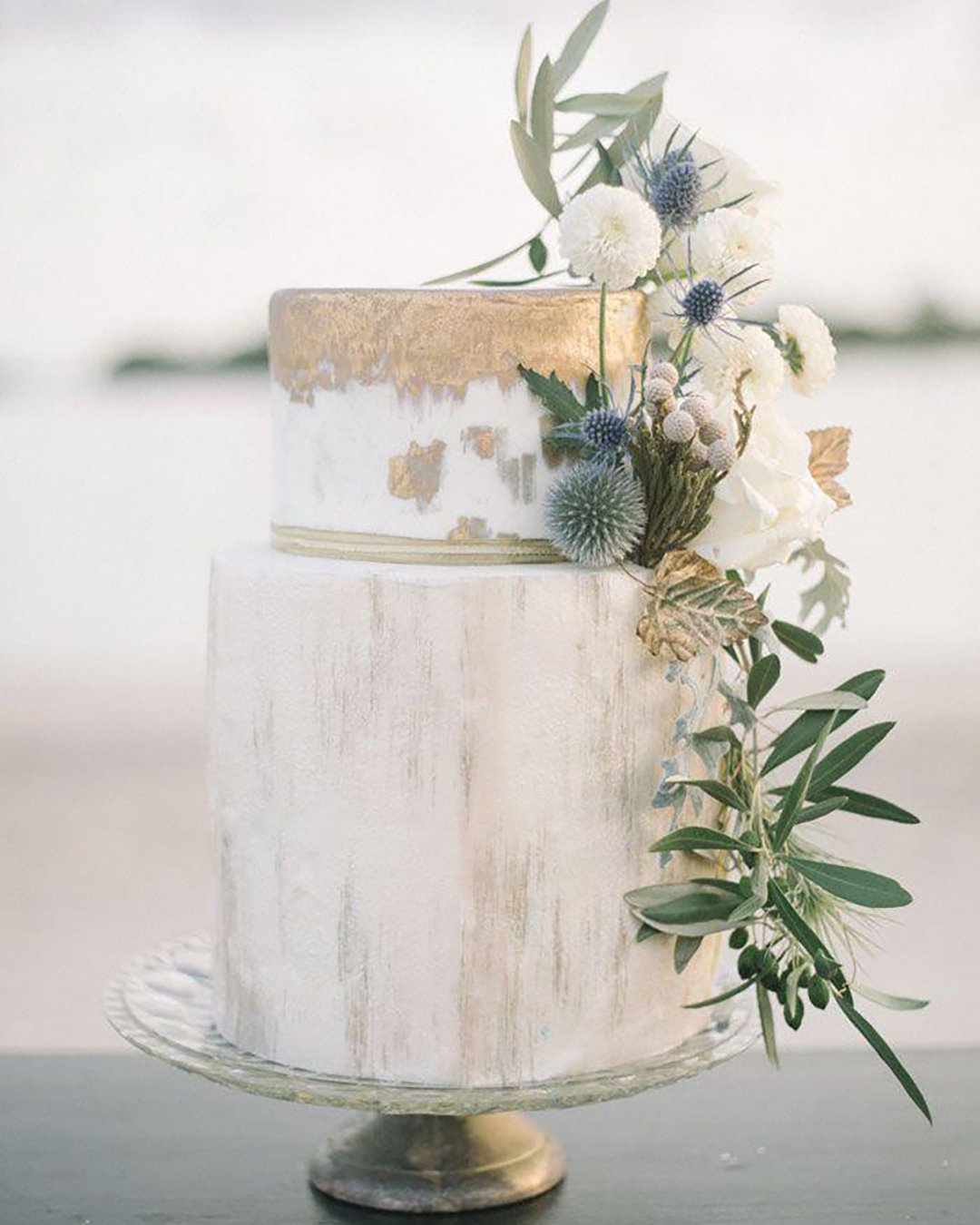 chic wedding cakes with golden touch and flowers blackbird photo