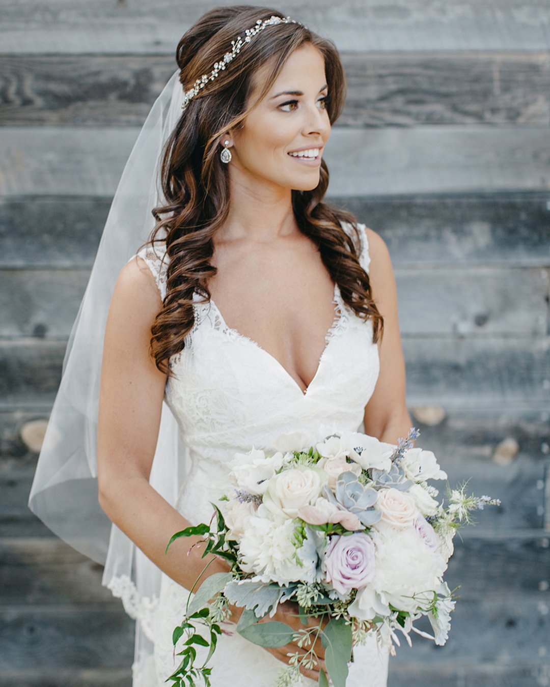 elegant wedding hairstyles half up half down with halo and veil evynn levalley photograph