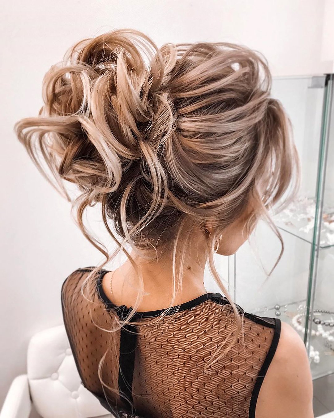 elegant wedding hairstyles textured high bun with loose curls tatistylespb