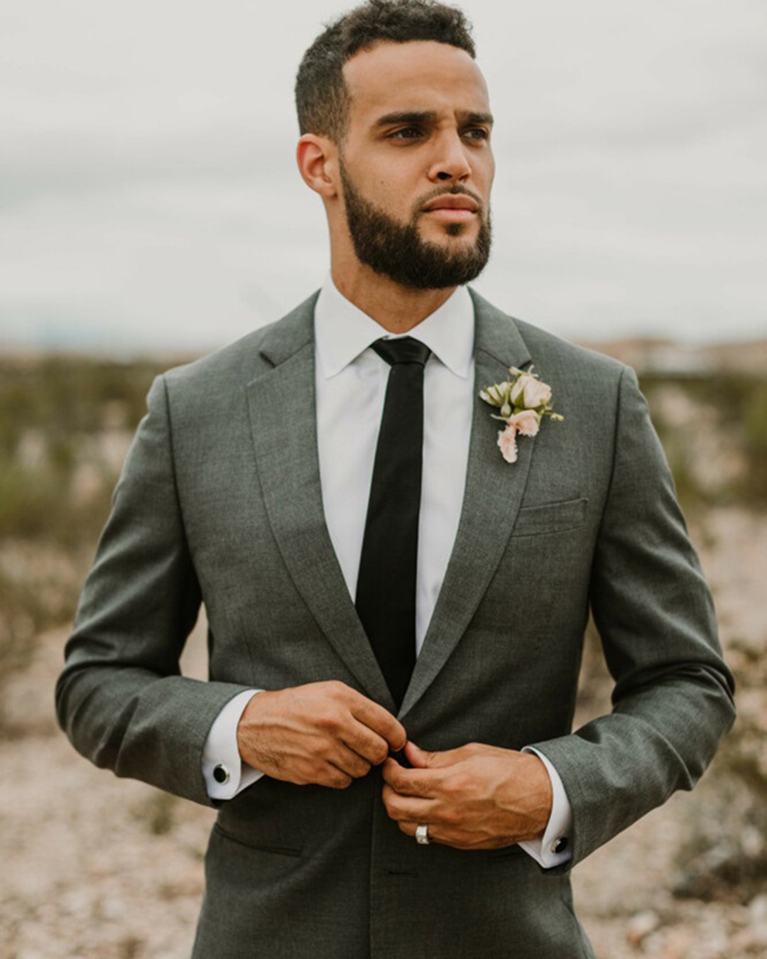 groom suits grey jacket with black tie boutonniere seila stone