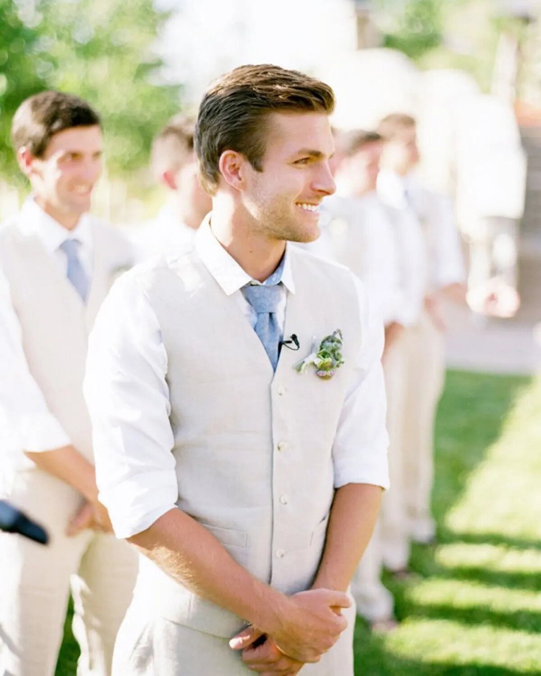 groomsmen attire vest white with tie and boutonniere Leo Patrone photography,