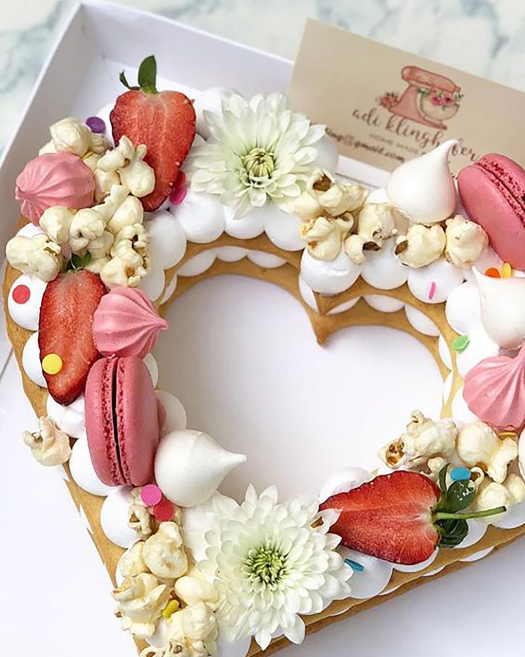 non traditional wedding dessert ideas tired heart shaped cake flowers and strawberries cake adikosh