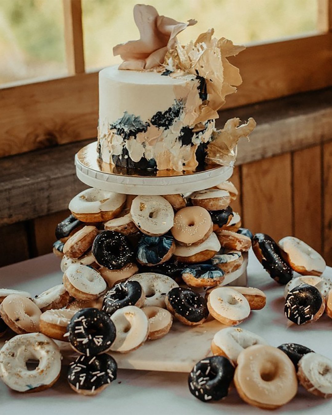 non traditional wedding dessert ideas wedding donuts with mini cake gabrielledesmarchais