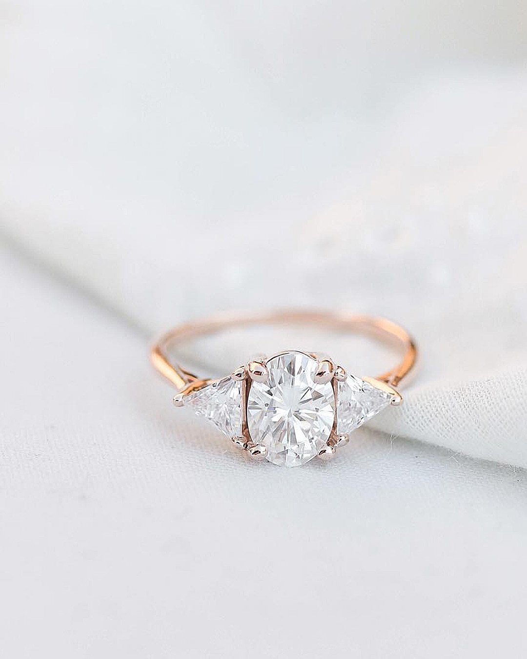 oval engagement rings rose gold three stones