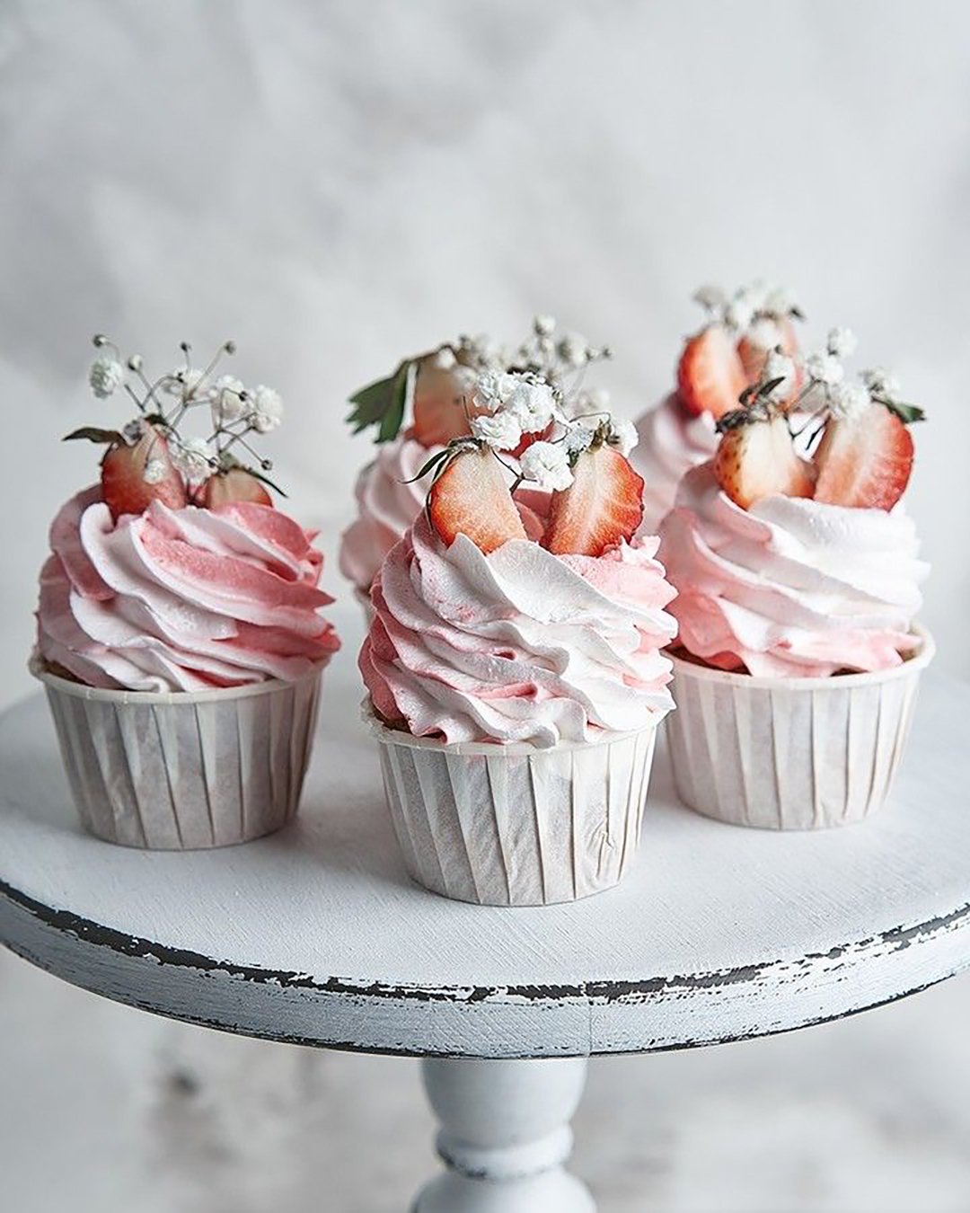 unique wedding cupcake ideas pink with baby breath and strawberries in rustic style annabel bakery