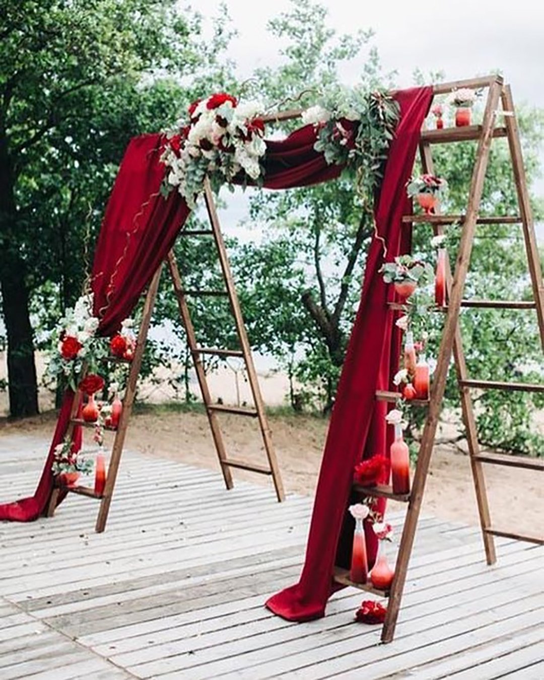velvet wedding decor arch with stairs and flowers colincowielifestyle