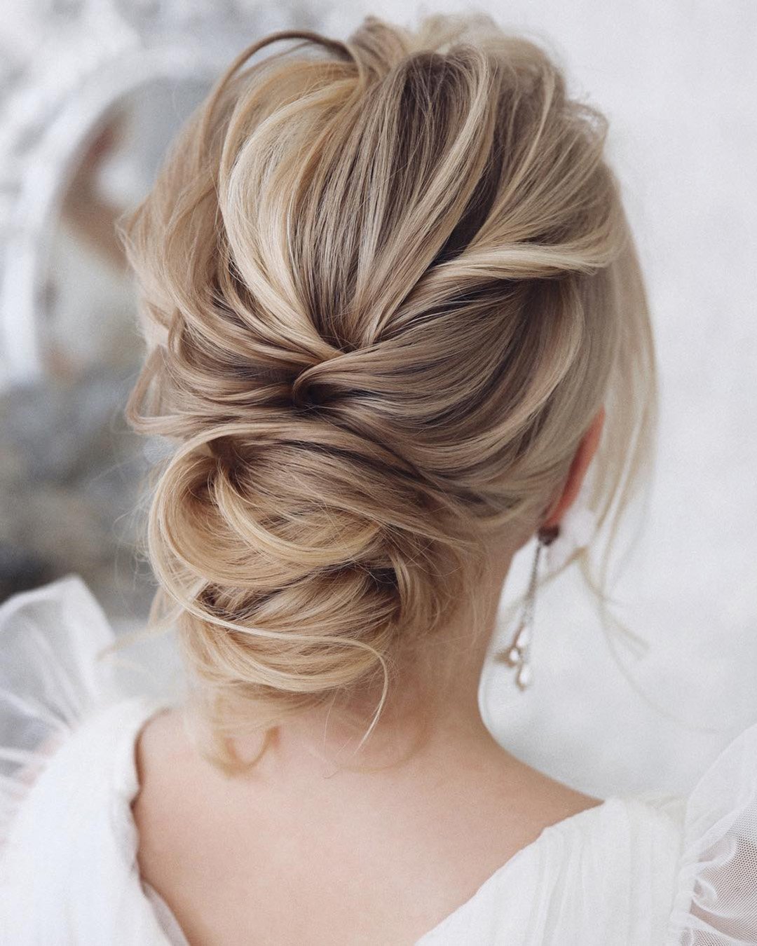 classic wedding hairstyles textured low bun on blonde hair tonyastylist