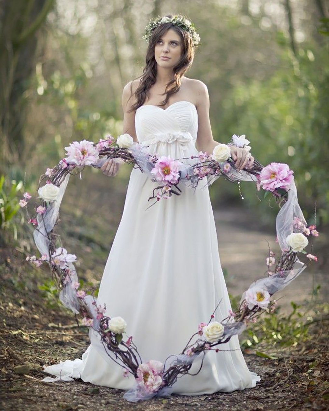heart wedding photos bride with floral heart in a wood mark tattersall photography