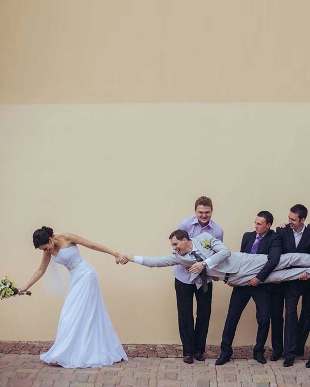 hilarious clever wedding photos bride pulls the groom from groomsmen creativa wedding photography