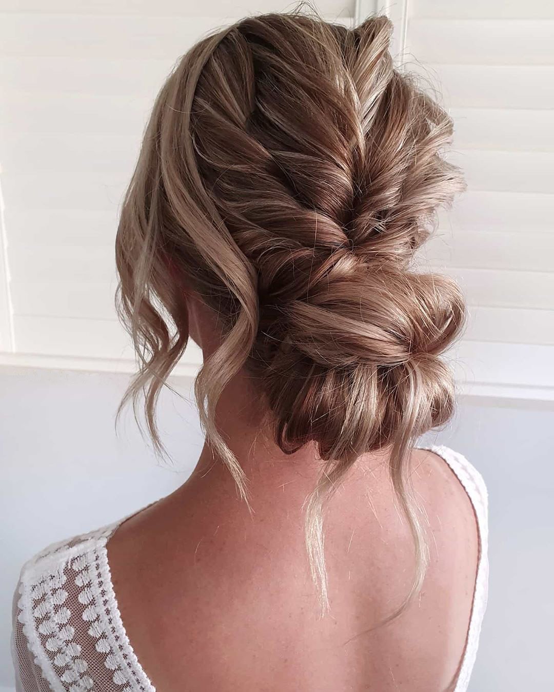 rustic wedding hairstyles updo swept low bun with loose curls cathughesxo