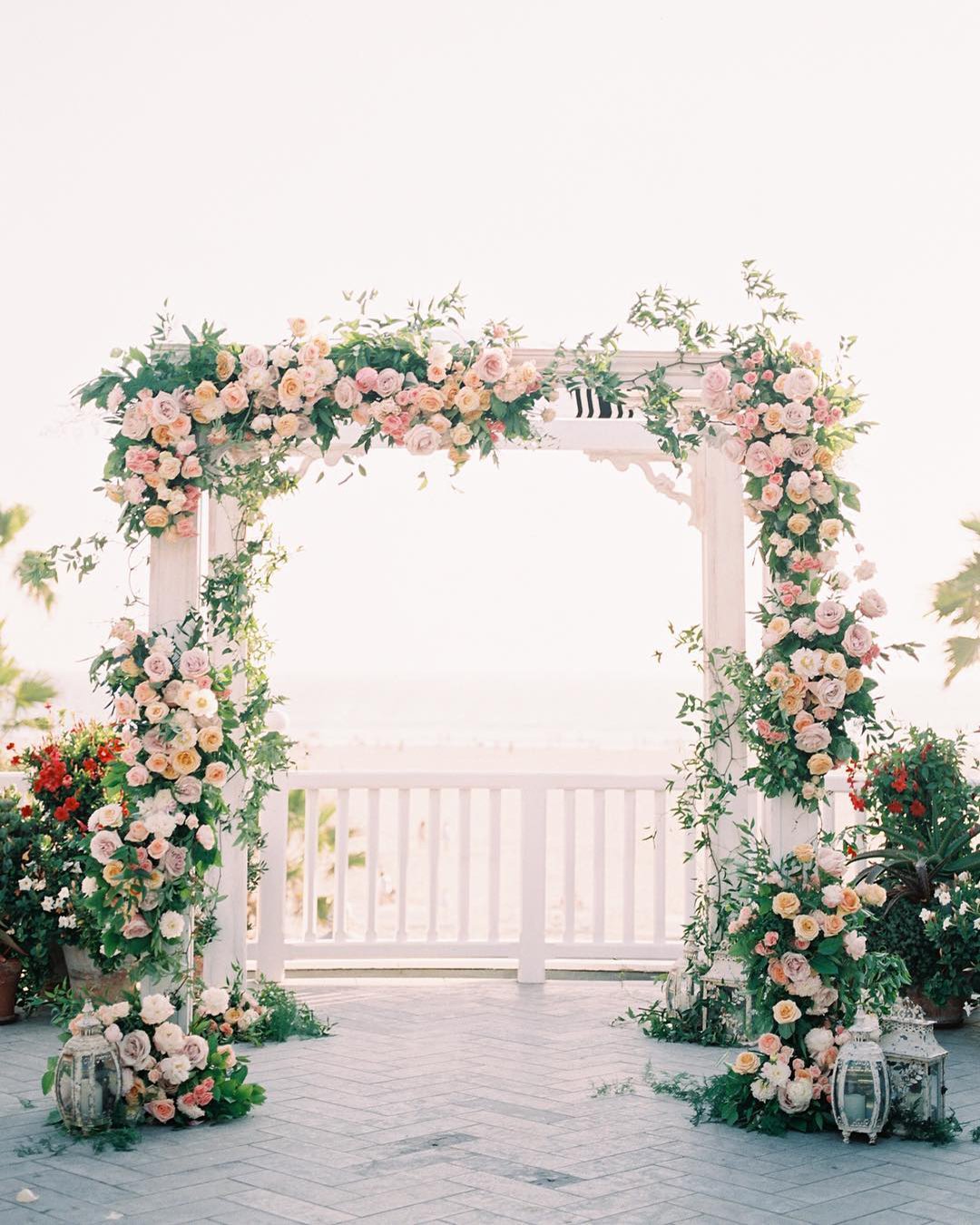 wedding ceremony decorations pink flower greenery arch aliciaminkphoto