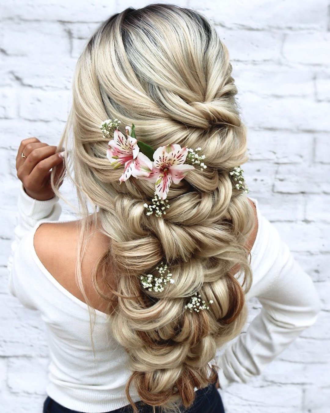wedding hairstyles with flowers cascading swept volume hair down hairspray_studio
