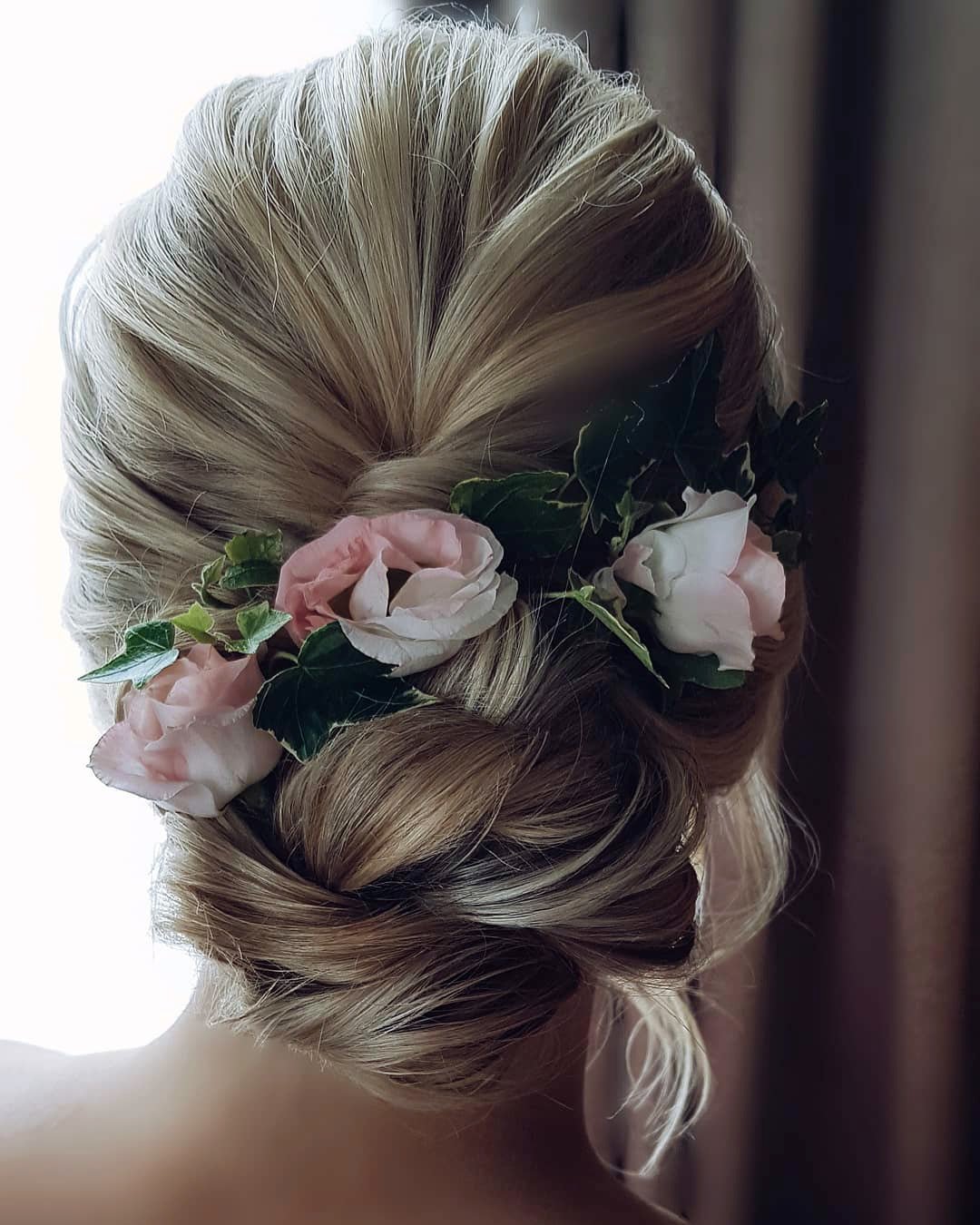 wedding hairstyles with flowers elegant swept low bun hairbyhannahtaylor