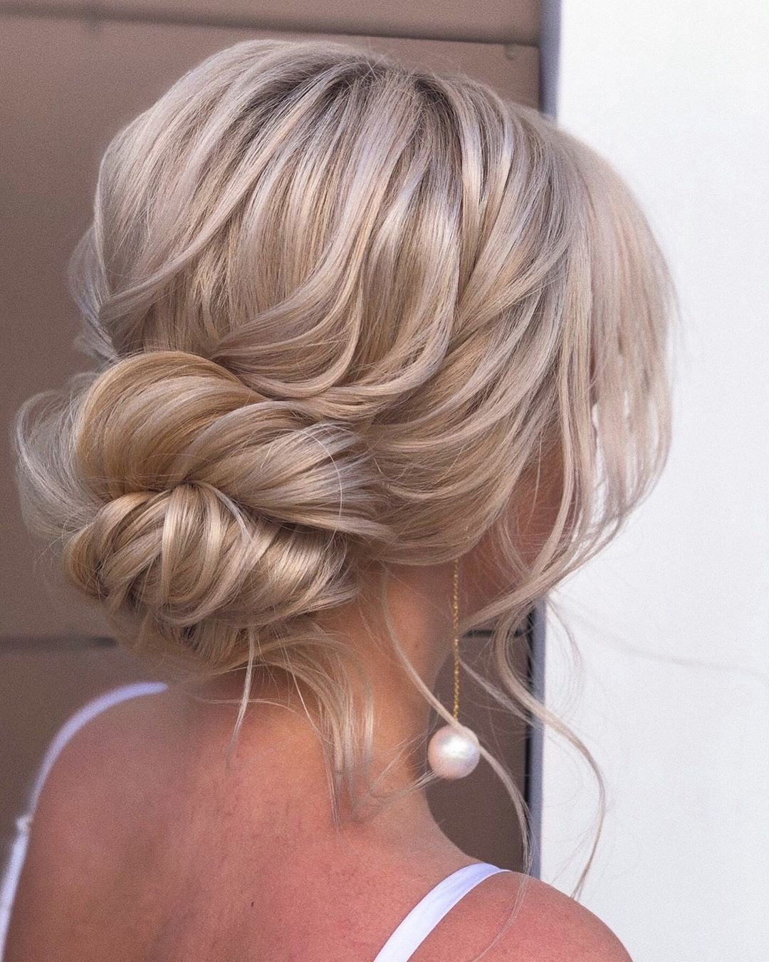 wedding updos for medium hair swept low bun on blonde xenia_stylist